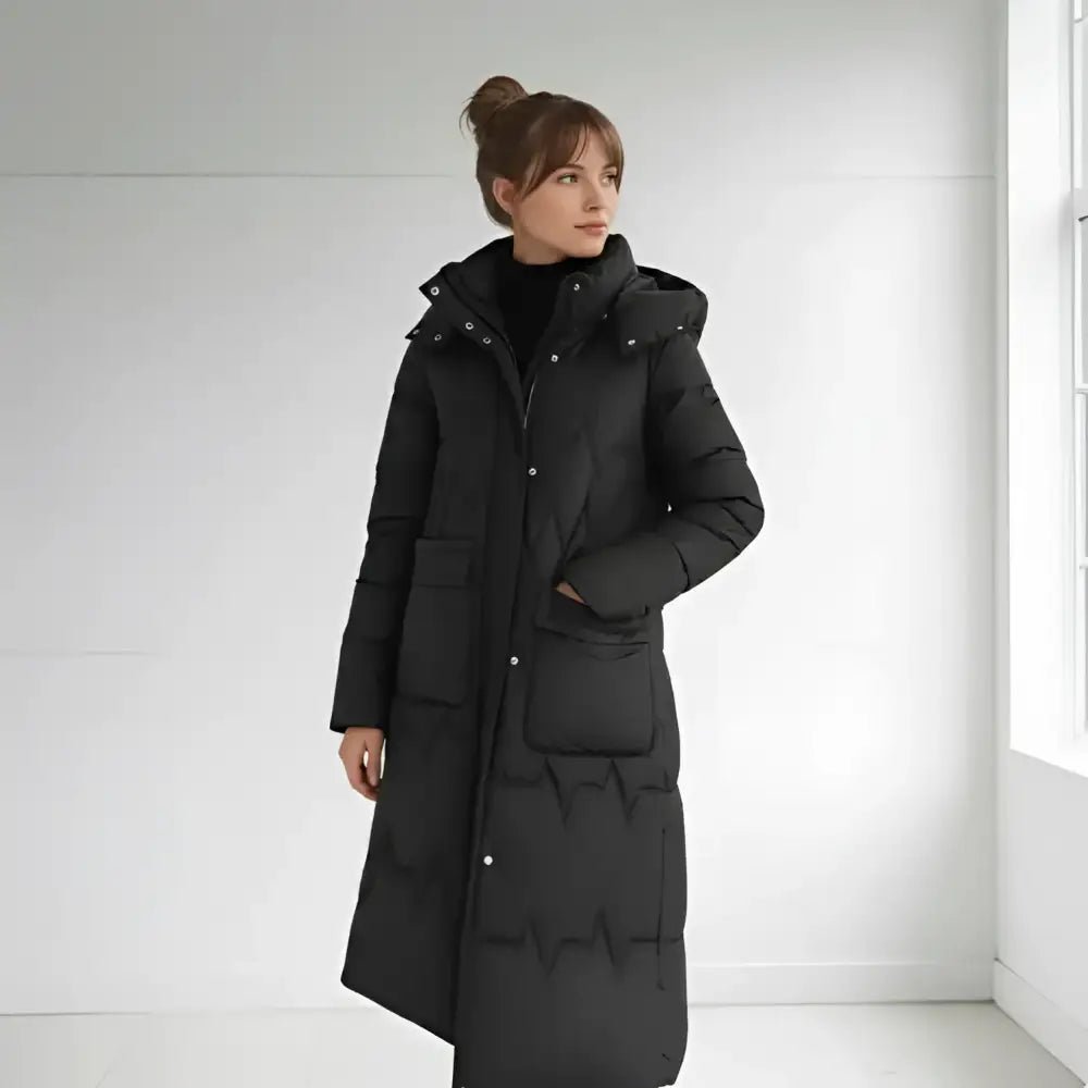 Parka femme matelassée hiver noire, longue et confortable pour les journées fraîches.