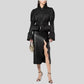 Parka femme chic avec capuche discrète, bomber noir, manches bouffantes et taille peplum