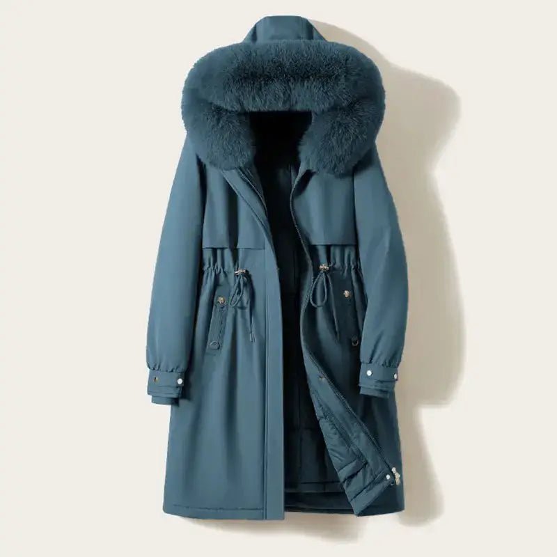 Parka femme longue col doux en couleur bleu avec col en fourrure.